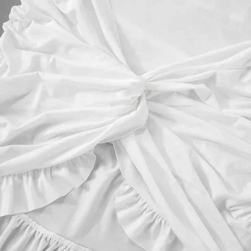 Luxe Long-Sleeve White Bodycon Mini Dress with Ruched Knot Detail and Ruffled Hemline