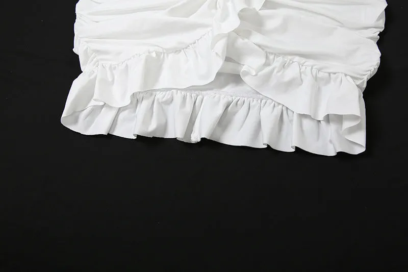 Luxe Long-Sleeve White Bodycon Mini Dress with Ruched Knot Detail and Ruffled Hemline