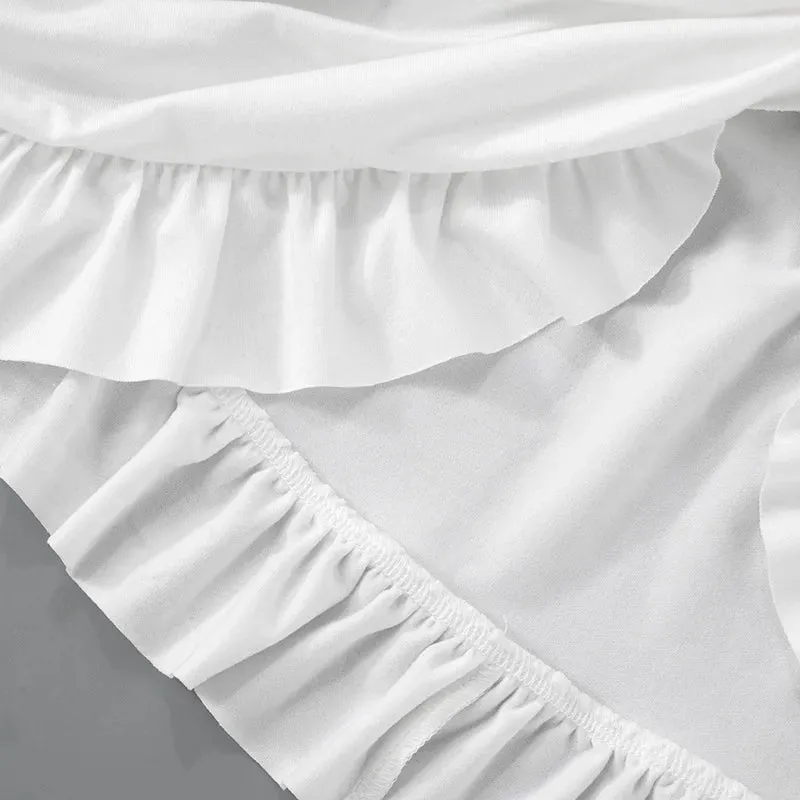 Luxe Long-Sleeve White Bodycon Mini Dress with Ruched Knot Detail and Ruffled Hemline